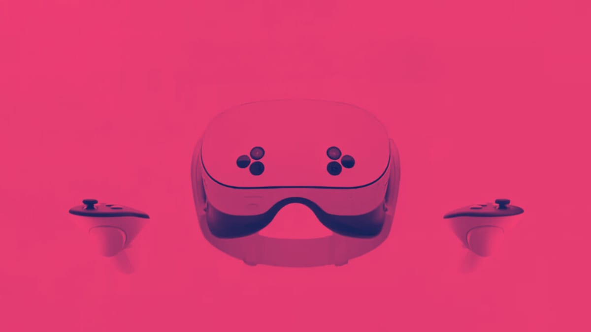 Meta Quest 3S headset flanked by its two Touch controllers, tinted pink