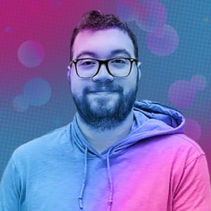 Headshot of Brandon, CEO of Clique Games, wearing glasses and a hoodie