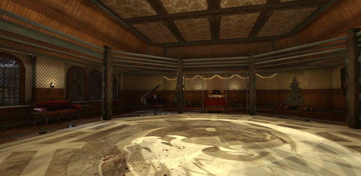 View from the floor of The Cage looking out at the wood-paneled hall, a grand piano, and a lit Christmas tree